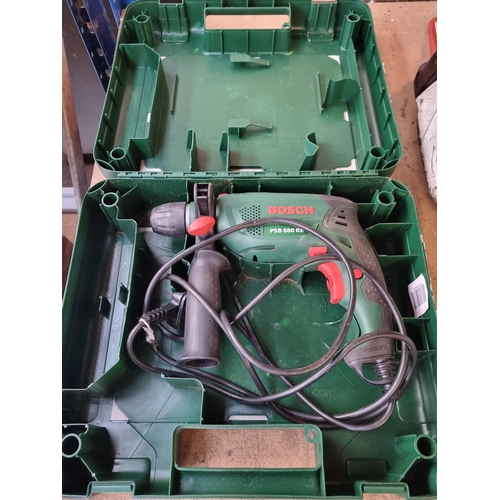 833 - A cased Bosch PSB680RE electric hammer drill