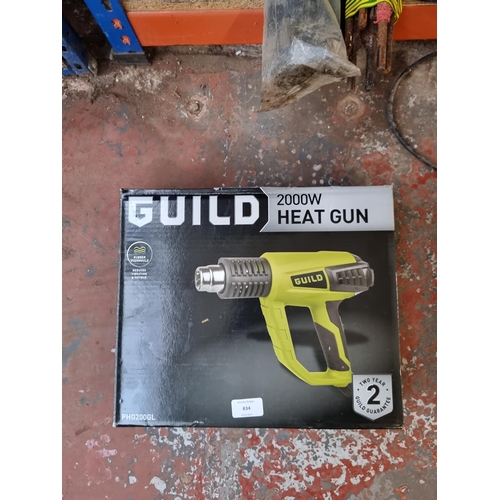 834 - A collection of tools to include boxed Guild 2000w heat gun, boxed Mac Allister MSSS220 quarter shee... 