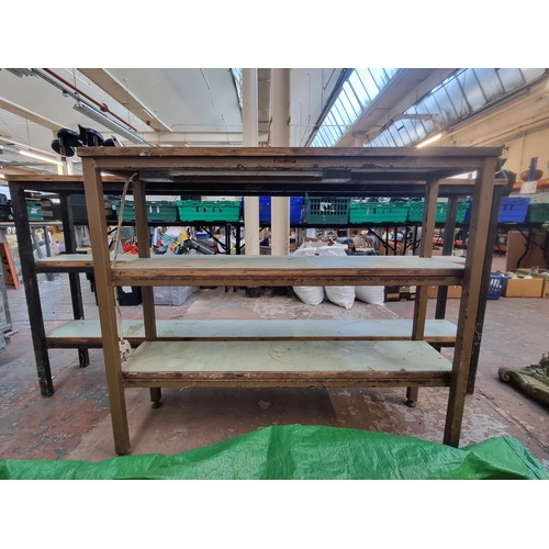 850 - Two mid 20th century Nortek Industrial Furniture three tier work tables - largest approx.  89cm high... 