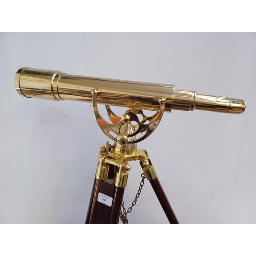 657 - A Victorian style brass telescope with mahogany and brass tripod