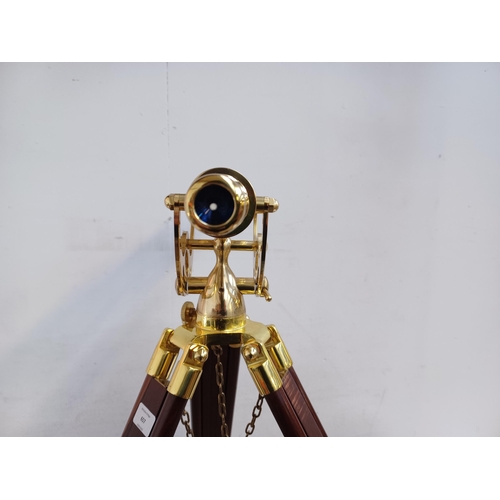 657 - A Victorian style brass telescope with mahogany and brass tripod