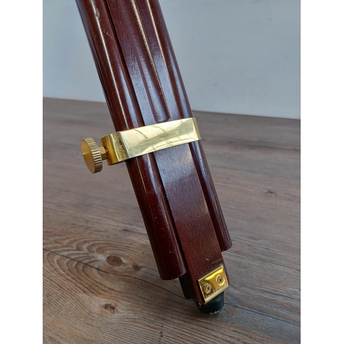 657 - A Victorian style brass telescope with mahogany and brass tripod