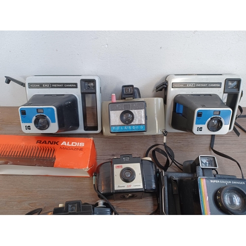 662 - A collection of cameras to include two Kodak EK2 instant, Polaroid Swinger Sentinal instant, three K... 