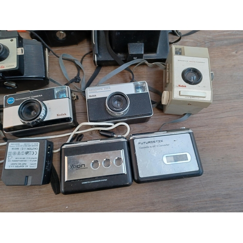 662 - A collection of cameras to include two Kodak EK2 instant, Polaroid Swinger Sentinal instant, three K... 