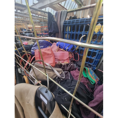 863 - A cage containing a large quantity of handbags clothing to include Ralph Lauren shirt, GAP paisley s... 