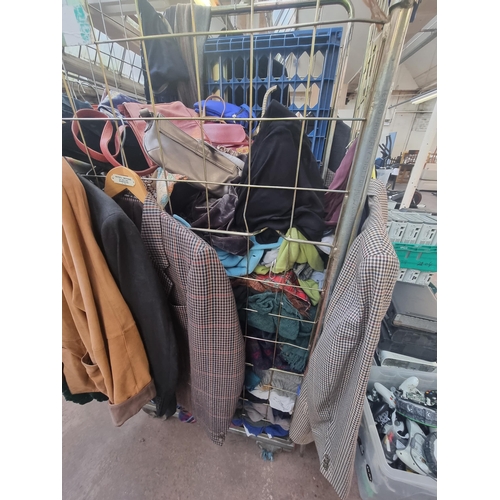 863 - A cage containing a large quantity of handbags clothing to include Ralph Lauren shirt, GAP paisley s... 