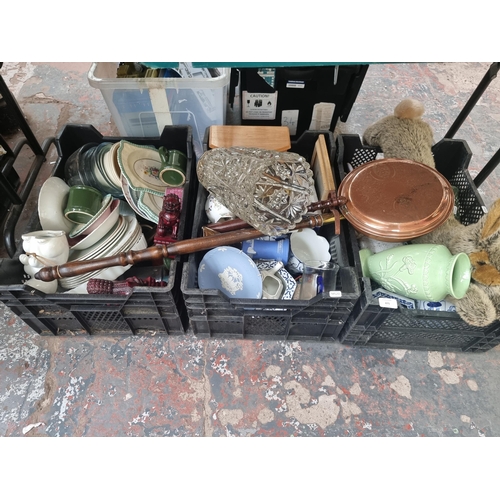 875 - Eight boxes containing rabbit draft excluder, copper bed warming pan, large glass vase, Wedgwood Jas... 