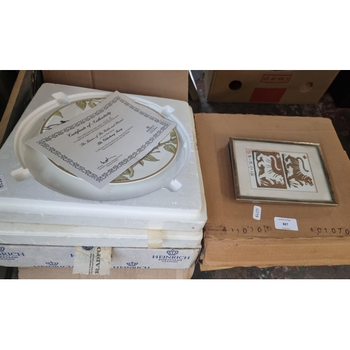 887 - A collection of items to include boxed collector's plates with certificates of authenticity, oil on ... 