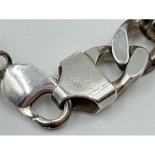 2121 - A .925 silver 18.5cm curb link bracelet - approx. gross weight 50.8 grams