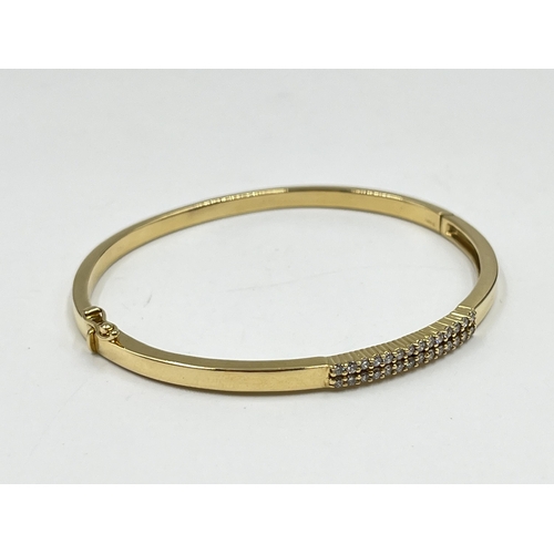 2123 - A hallmarked 18ct gold and diamond bangle - approx. gross weight 19.9 grams