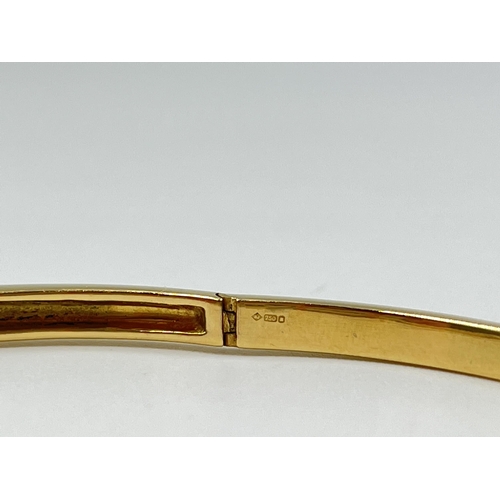 2123 - A hallmarked 18ct gold and diamond bangle - approx. gross weight 19.9 grams