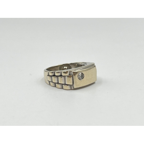 2127 - A white metal diamond ring with jubilee strap design, size K - approx. gross weight 12.69 grams