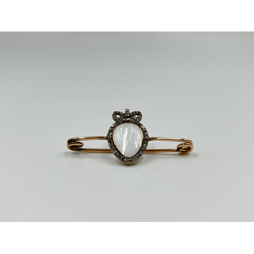 2154 - An antique yellow metal and diamond memento brooch - approx. gross weight 4.28 grams