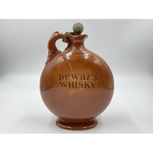 293 - A Royal Doulton Kingsware No.181 Dewar's Whisky flask - approx. 20cm high