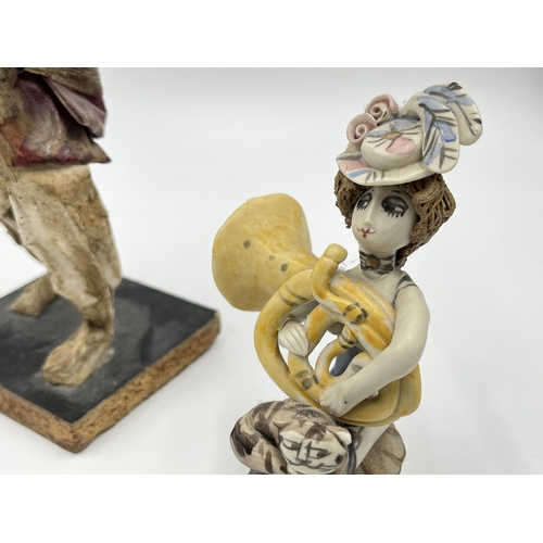 302 - Two figurines, one studio pottery signed B to base and one papier-mâché