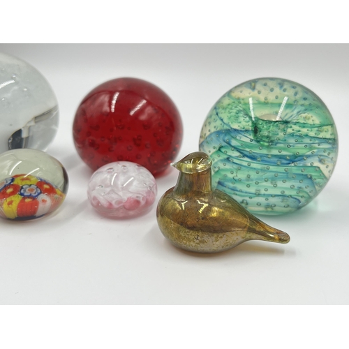 304 - Seven studio glass paperweights to include Caithness Spinaway, Rosenthal, Millefiori etc.