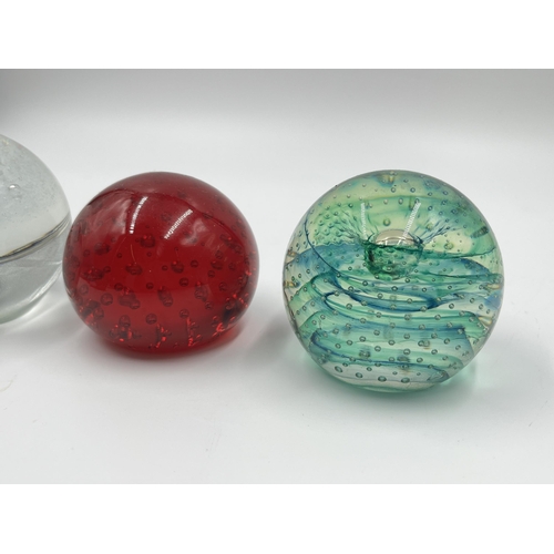 304 - Seven studio glass paperweights to include Caithness Spinaway, Rosenthal, Millefiori etc.