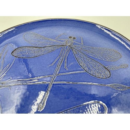 310 - A blue studio pottery dragonfly design plate - approx. 30cm diameter