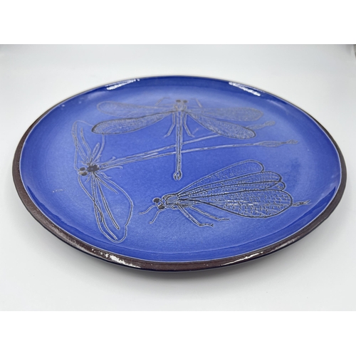 310 - A blue studio pottery dragonfly design plate - approx. 30cm diameter