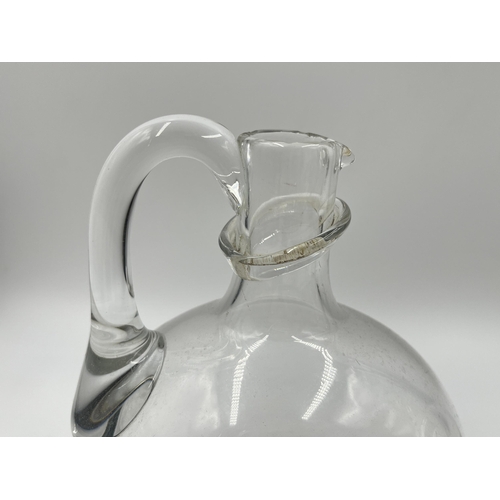 311 - A pair of Victorian style clear glass decanters - approx. 19cm high