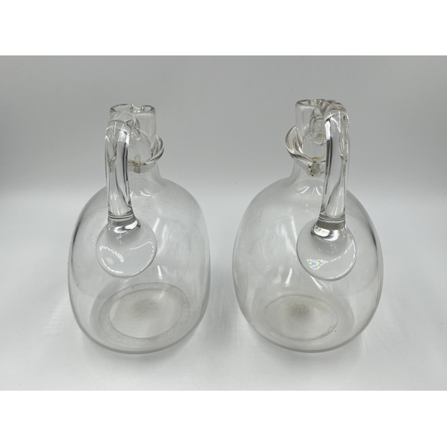 311 - A pair of Victorian style clear glass decanters - approx. 19cm high