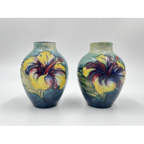 314A - A pair of Moorcroft Hibiscus pattern vases - approx. 9cm high