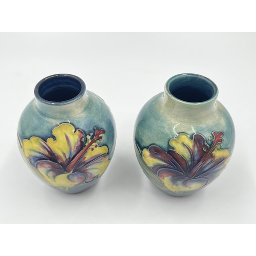 314A - A pair of Moorcroft Hibiscus pattern vases - approx. 9cm high