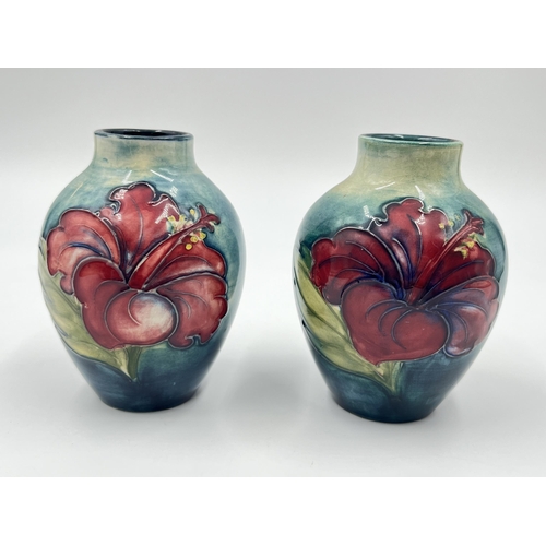 314A - A pair of Moorcroft Hibiscus pattern vases - approx. 9cm high