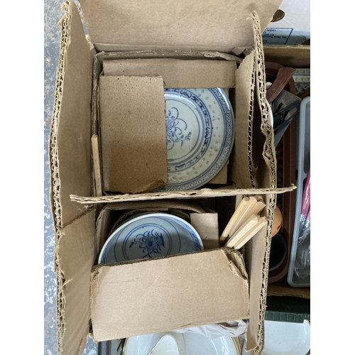 890 - Eight boxes containing character jug, ceramic headed doll marked Chili, table lamps, boxed rice bowl... 