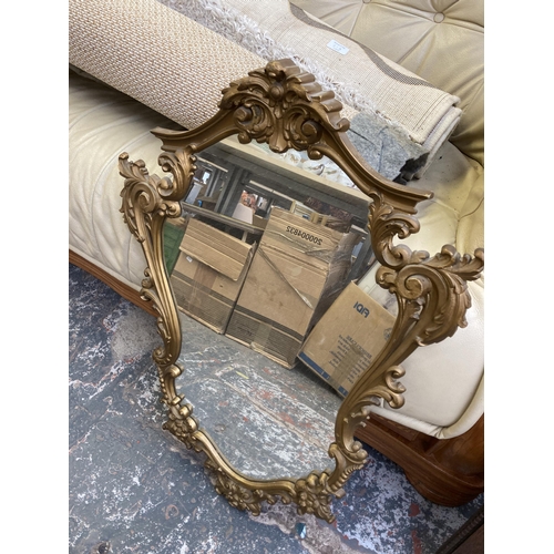 910 - Three items, Rococo style gilt framed wall mirror, early 20th century oak framed bevelled edge octag... 