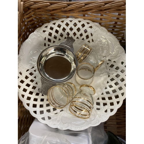 919 - A wicker basket containing glassware and ceramics