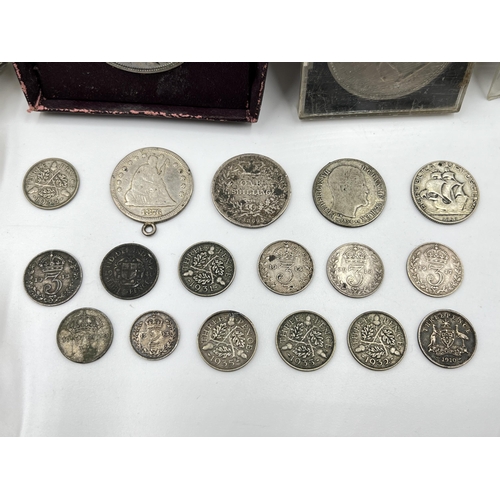 2373 - A collection of world coins to include .925 silver 1866 shilling, .900 silver 'Seated Liberty' ¼ Dol... 