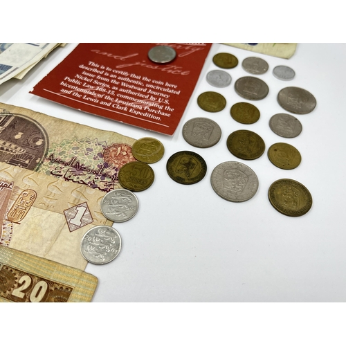 2374 - A collection of worldwide currency to include 240 Francs, 31 Egyptian pounds, 1977 Elizabeth II silv... 