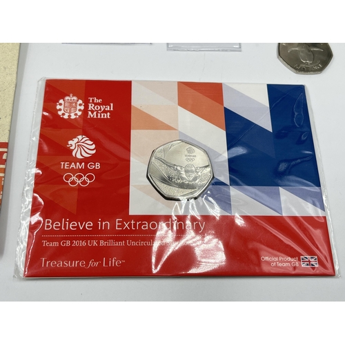 2375 - A collection of 50p coins and first day covers to include to include Royal Mint The 75th Anniversary... 