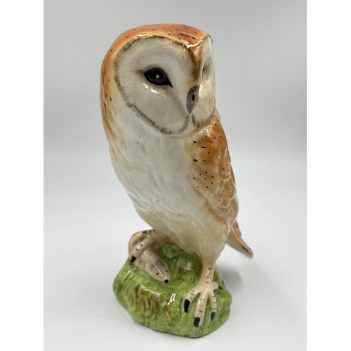 244 - A hand painted ceramic barn owl figurine - approx. 21cm high