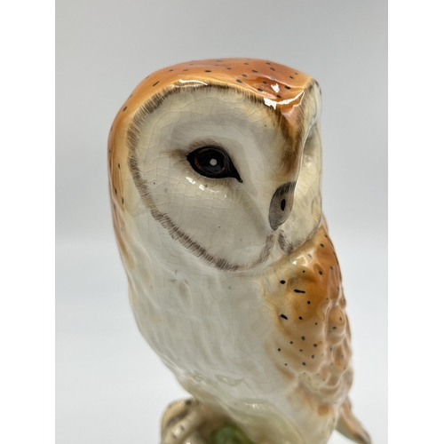 244 - A hand painted ceramic barn owl figurine - approx. 21cm high