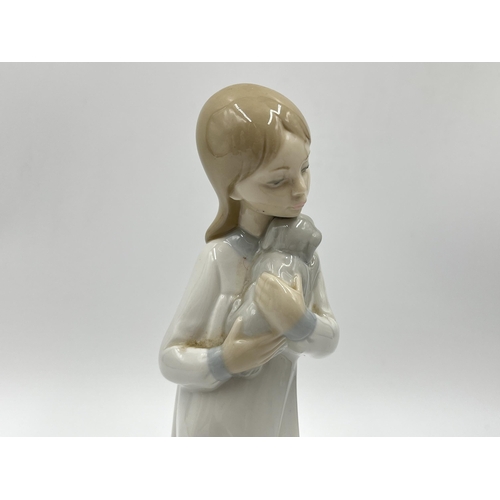 248 - Three Spanish porcelain figurines, two Nao by Lladro and one Miquel Requena - largest approx. 27cm h... 