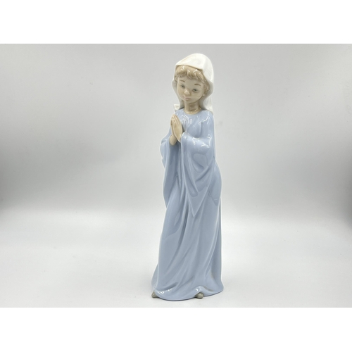 248 - Three Spanish porcelain figurines, two Nao by Lladro and one Miquel Requena - largest approx. 27cm h... 