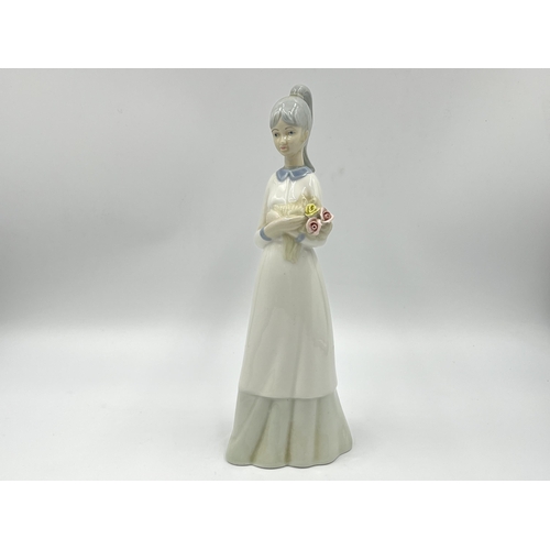 248 - Three Spanish porcelain figurines, two Nao by Lladro and one Miquel Requena - largest approx. 27cm h... 