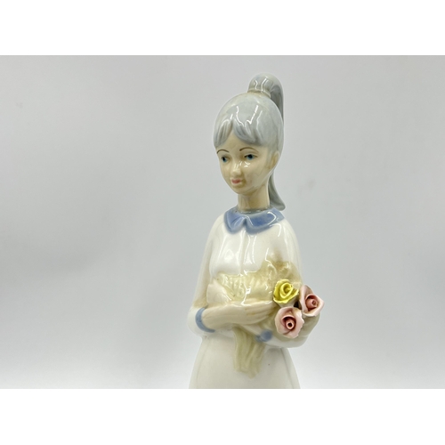 248 - Three Spanish porcelain figurines, two Nao by Lladro and one Miquel Requena - largest approx. 27cm h... 