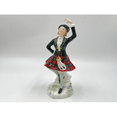 253 - Four ceramic figurines to include Coalport Emma, Royal Adderley Highland Fling etc.