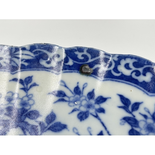 276 - An Oriental blue and white transfer printed porcelain charger with bird and foliate design - approx.... 