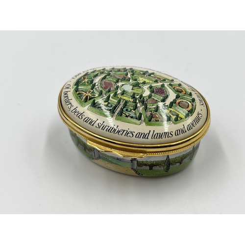 281 - A boxed Halcyon Days The Glory of the Garden enamel pill box - approx. 2.5cm high x 5.5cm wide x 4.5... 