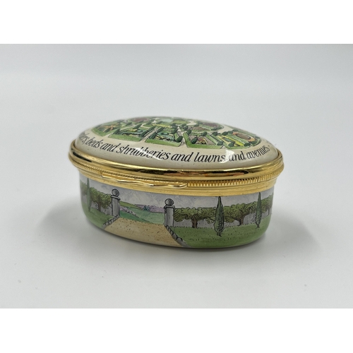 281 - A boxed Halcyon Days The Glory of the Garden enamel pill box - approx. 2.5cm high x 5.5cm wide x 4.5... 