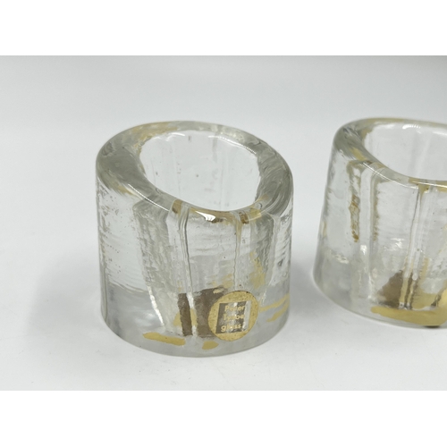 282 - A pair of mid 20th century Peter Tysoe studio glass candle holders - approx. 5cm high