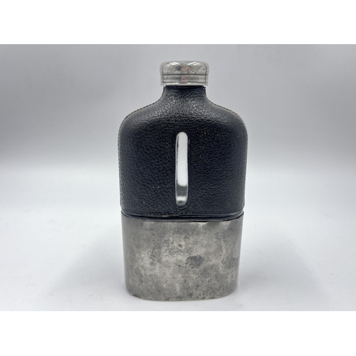 2252 - A late 19th/early 20th century pewter, leather and glass hip flask - approx. 15cm high