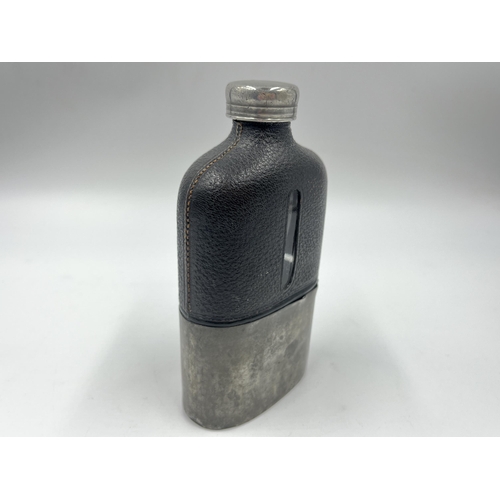 2252 - A late 19th/early 20th century pewter, leather and glass hip flask - approx. 15cm high