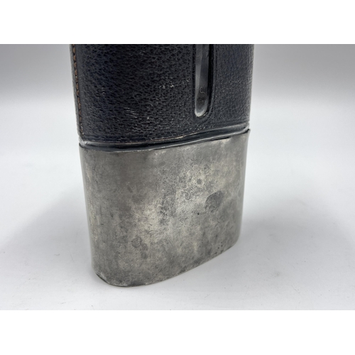 2252 - A late 19th/early 20th century pewter, leather and glass hip flask - approx. 15cm high