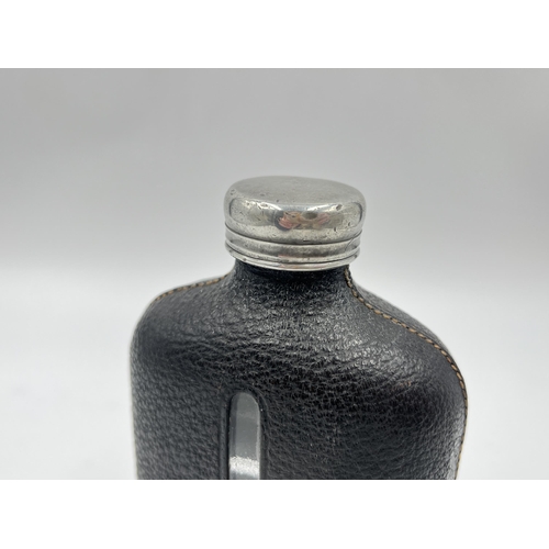 2252 - A late 19th/early 20th century pewter, leather and glass hip flask - approx. 15cm high