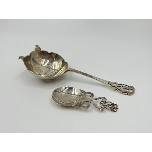 2259 - Two hallmarked sterling silver spoons, one Walker & Hall Sheffield silver sugar sifter dated 1935 an... 